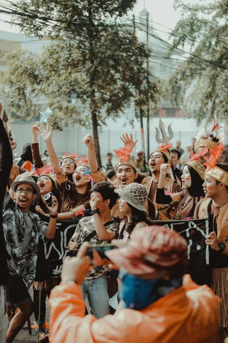 A group of people raising their arms