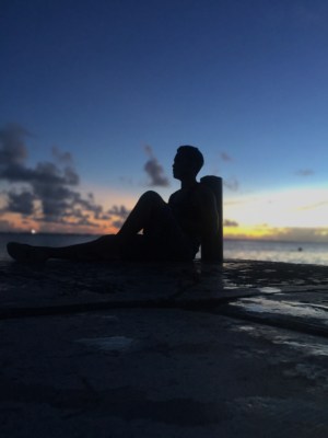 Silhouette of man sitting at beach