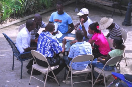 A group of people sitting round a table