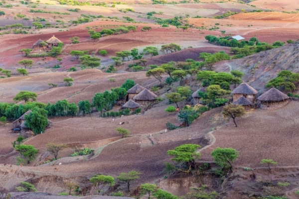 Highland landscape with traditional Ethiopian houses.