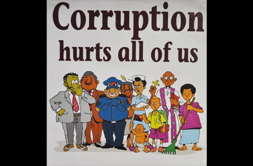 A poster reading "corruption hurts all of us"